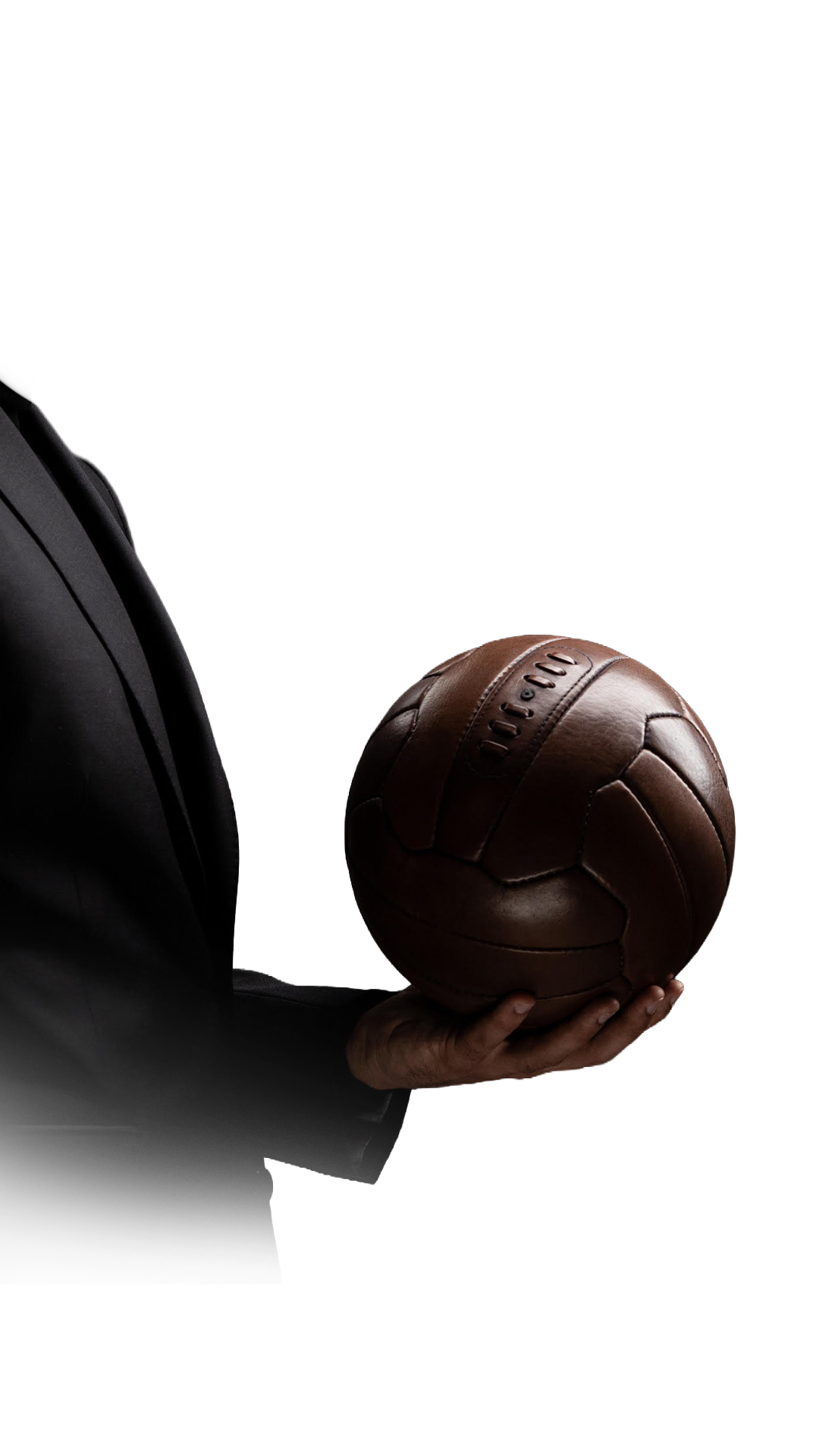 Hand holding a vintage leather football